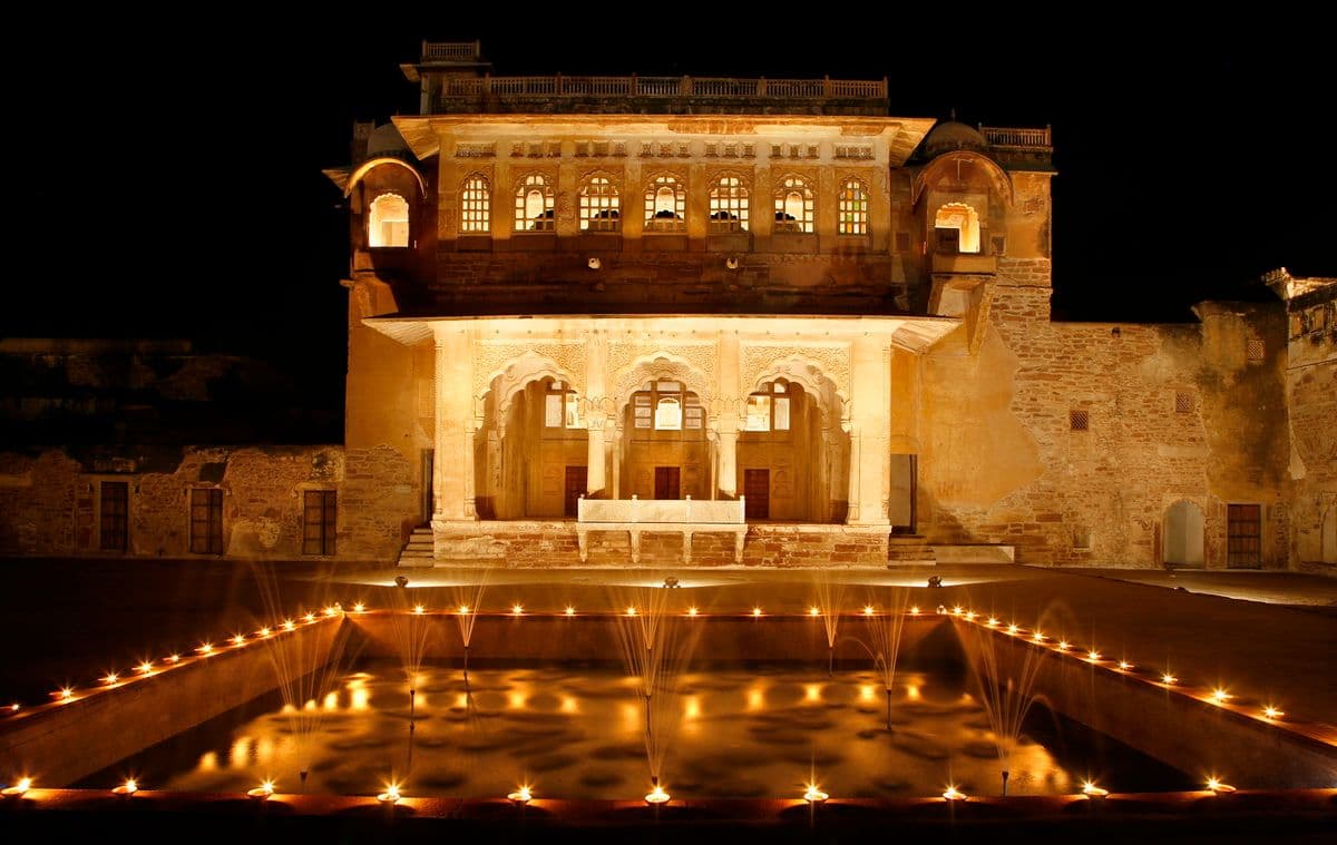 Ahhichatragarh Fort at night reflected in water